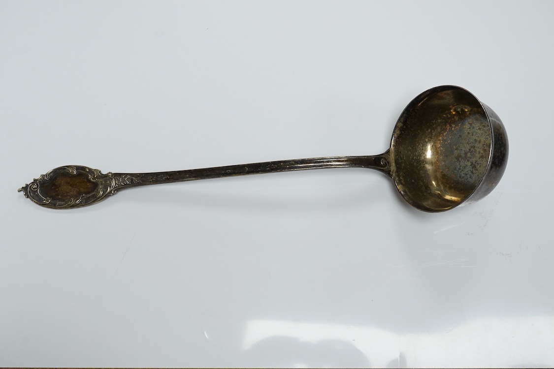 A German 800 standard white metal soup ladle, 36.3cm, 8.7oz.